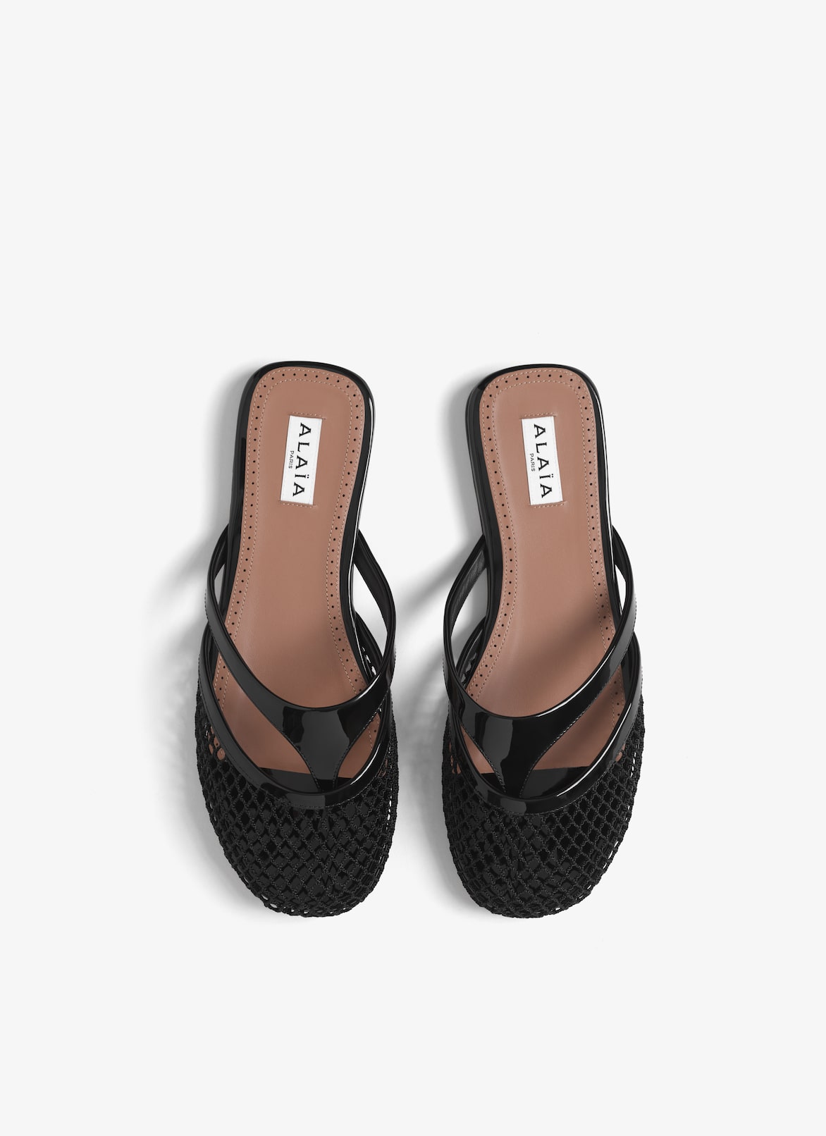 INFRADITO FLAT MULES IN FISHNET AND LEATHER ALAÏA BLACK INFRADITO FLAT MULES IN FISHNET AND LEATHER